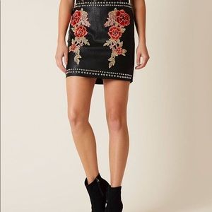 Black skirt with floral design and studs